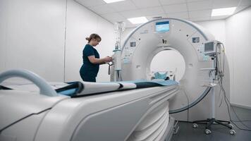 Tomography specialist, doctor, assistant preparing computed tomography for examination in a CT scan room. Professional Neurologist Analysing CT Scan, Finding Treatment Solutions for Patient video