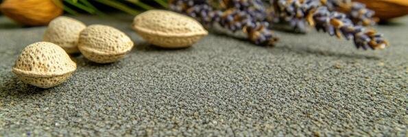 Almonds and lavender on textured surface highlighting natural ingredients photo