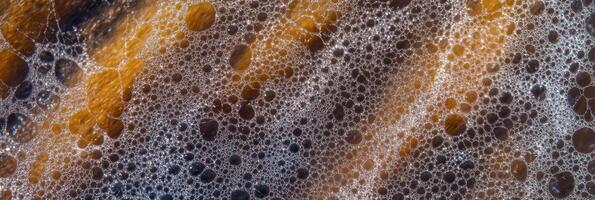 Close-up of coffee bubbles and foam with textured background photo