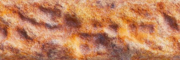 Textured rust pattern with vibrant orange and brown hues for background design photo