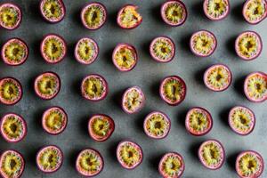 Pattern of fresh passion fruit halves in an artistic geometric arrangement photo