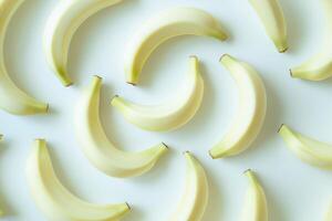 Fresh yellow bananas pattern isolated on a minimal white background photo