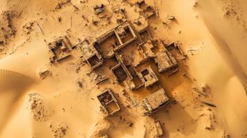 Aerial view of ancient ruins in sandy desert landscape reflecting historical architecture. photo