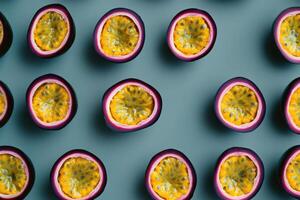 Sliced passion fruits arranged in neat rows on a green surface background photo