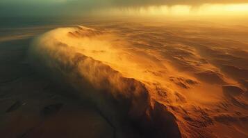 Aerial view of desert sandstorm over dunes during golden hour sunset photo