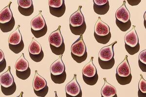 Sliced figs pattern on beige background in direct sunlight showcasing texture photo