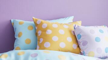 Colorful polka dot pattern pillows on soft pastel background in cozy bedroom photo