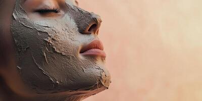 Female with clay face mask relaxing during sunset skincare treatment photo