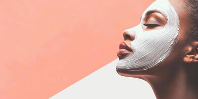 Female with facial mask in profile view on peach background concept of skincare and relaxation photo