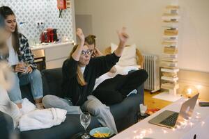 A Group of Friends Enjoying a Cozy and Relaxing Night In Together in Their Apartment Space photo