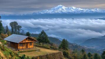 Snow-Draped Mountains and a Serene Cottage Below the Clouds photo