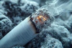 Smoking Dangers in Winter Burning Cigarette Surrounded by Snow for Health Campaigns photo