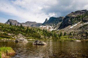 Landscape of Siberia sightly Ergaki mountains, mountain range in haze summer photo