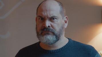 Man getting furious looking into camera lens video