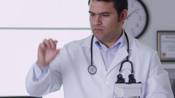 Veterinarian using a microscope video
