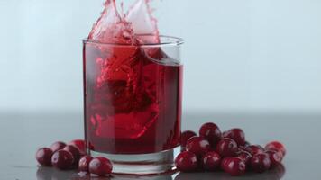 Ice splashing into cranberry juice in slow motion shot on Phantom Flex 4K at 1000 fps video