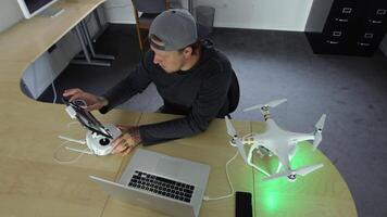Man in office working with drone video