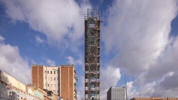 A tall building with scaffolding on it video