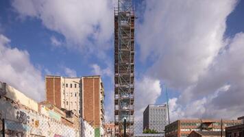 A tall building with scaffolding on it video