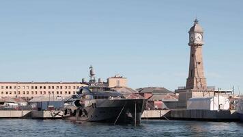 A boat is docked in front of a clock tower video