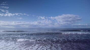 A view of the ocean and sky from the beach video