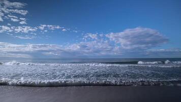 A view of the ocean and sky from the beach video