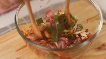 Step-by-step procedures to marinate pork for easy Korean cooking, add chopped onions and Japanese bunching onion, sesame oil, soy sauce, Korean gochujang and mix well. Korean homemade food for lunch video