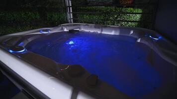 Running Modern Residential Hot Tub Illuminated by Blue LED light video