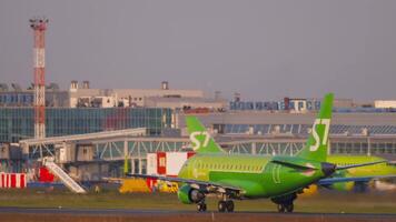 NOVOSIBIRSK, RUSSIAN FEDERATION JUNE 17, 2020 - Airbus A320 of S7 Airlines accelerating for takeoff at Tolmachevo airport, side view. Tourism and travel concept video