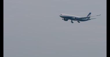 PHUKET, THAILAND JANUARY 31, 2023 - Footage Airbus A330, OY VKJ of Sunclass Airlines landing approach to Phuket airport. Side view of jet passenger plane flies. Tourism and travel concept video