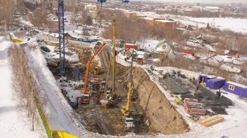 Top view, working machinery and builders. Construction crane on site. Construction of a multi storey building video
