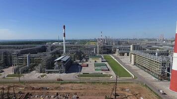 An aerial view of a large piping system of an oil refinery video