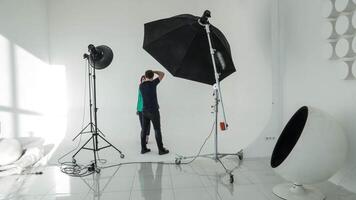 Timelapse of photographer and model working in studio video