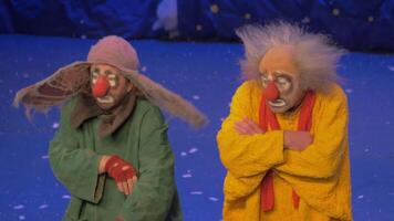 On snow show of Slava Polunin acts are two clowns and start to gesticulate video