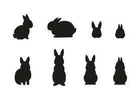 Set of simple black different rabbit silhouettes isolated on white background vector