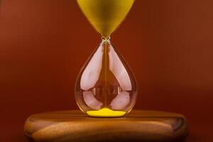 Hourglass photograph in studio, concept of time and daily life and the aging process. photo