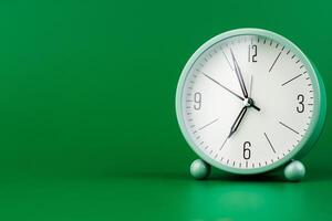 Clock tells the concept of working with valuable time, time management and time keeping. photo