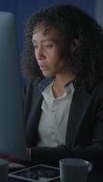 Dedicated and Ambitious Professional Working Late Into the Night at a Desk in a Corporate Office video