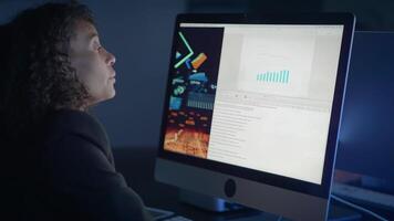A Focused Professional Diligently Analyzing Data on a Computer Screen in an Office Setting video