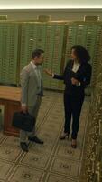 A Business Meeting Taking Place in a Secure Vault Room Designed for Confidential Discussions video