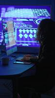 A person working on a computer with advanced graphics represents the possibilities of technology video
