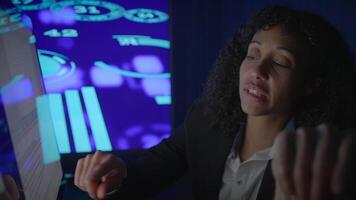 A Business Professional is Engaged in Analyzing Data Insights While in a Dark Environment video