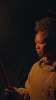 A contemplative person is portrayed in soft, dim light that creates a serene atmosphere video