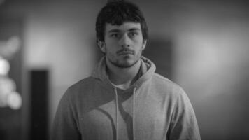 A Contemplative Young Man Reflecting in a Dynamic Urban Urban Setting Filled with Life video
