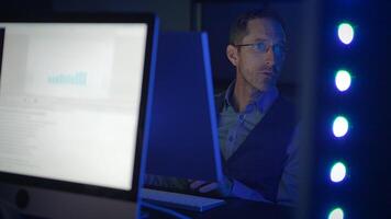 A Focused Professional Engaged in Thoroughly Analyzing Data Utilizing Advanced Computer Technology video