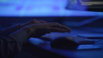 A CloseUp of Hands Actively Typing on a Computer Keyboard in a Dimly Lit Room Environment video