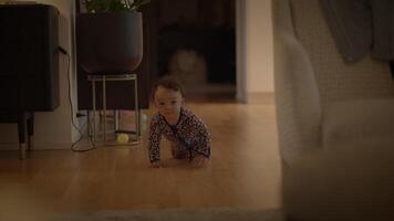 A happy baby is crawling in a cozy, modern living room filled with warmth and joy video