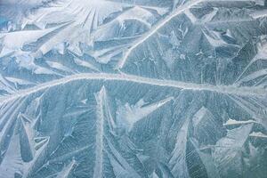 nature draws frost patterns on the glass with the freezing air temperature,abstract winter pattern photo