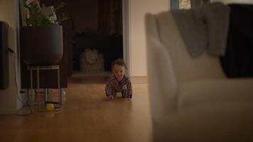 A cute baby is happily crawling in a cozy home, enjoying joyful moments of exploration video