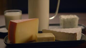 A Display of Assorted Dairy Products Featuring a Variety of Cheese Types and Fresh Milk video